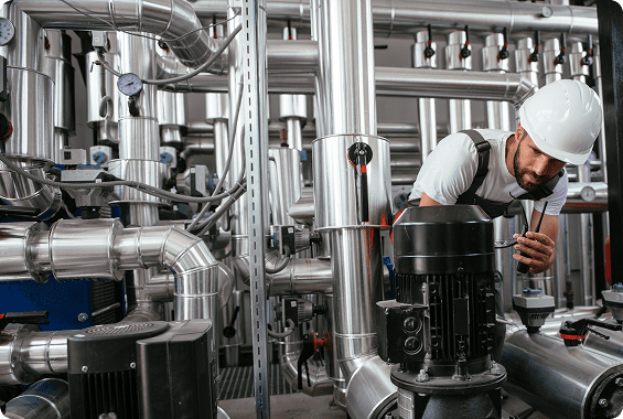 Engineer inspecting industrial machinery system